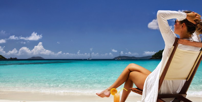 woman-relaxing-in-chair-with-cocktail-at-the-caribbean-beach.jpg