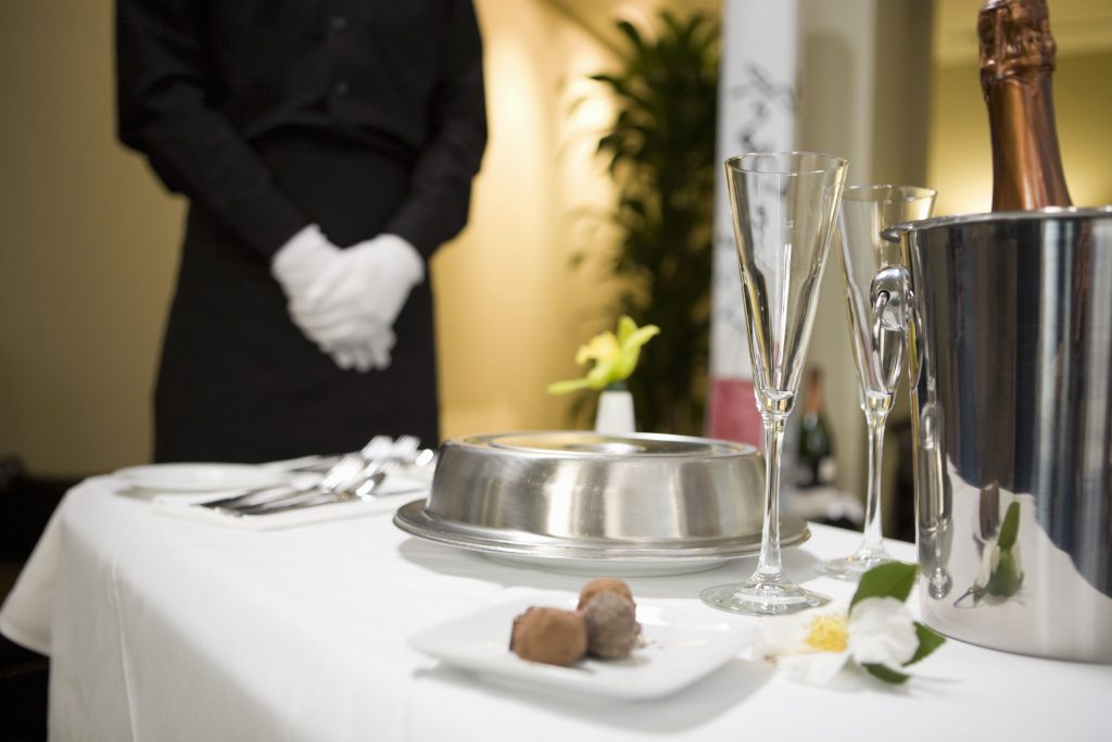 room-service-tray-with-food-and-champagne-80648485-59306bb55f9b589eb46068ba